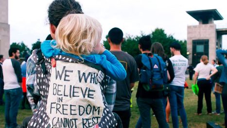 Parent and child with sign reading 